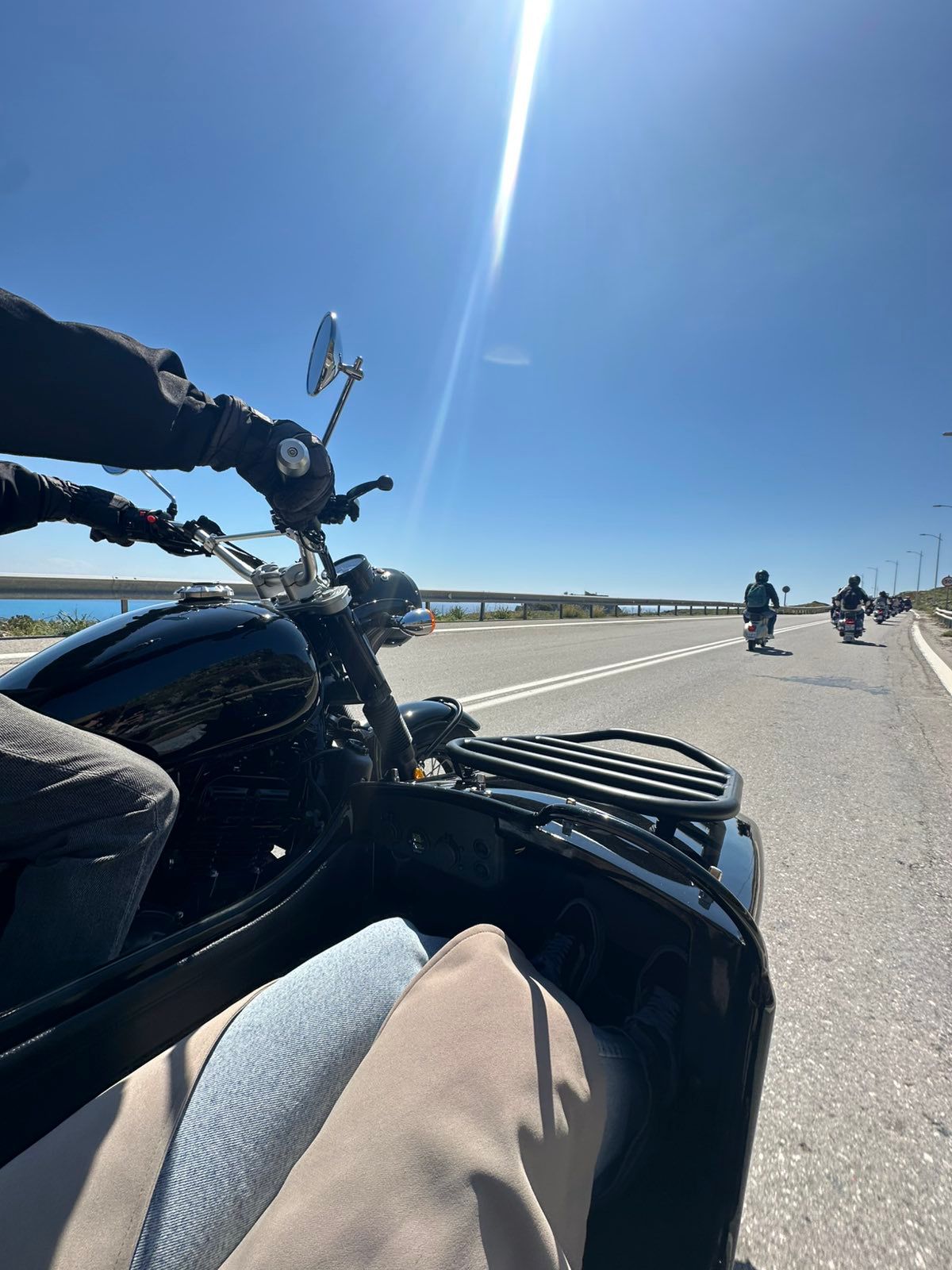 Vintage sidecar parked with a sweeping view of Rhodes