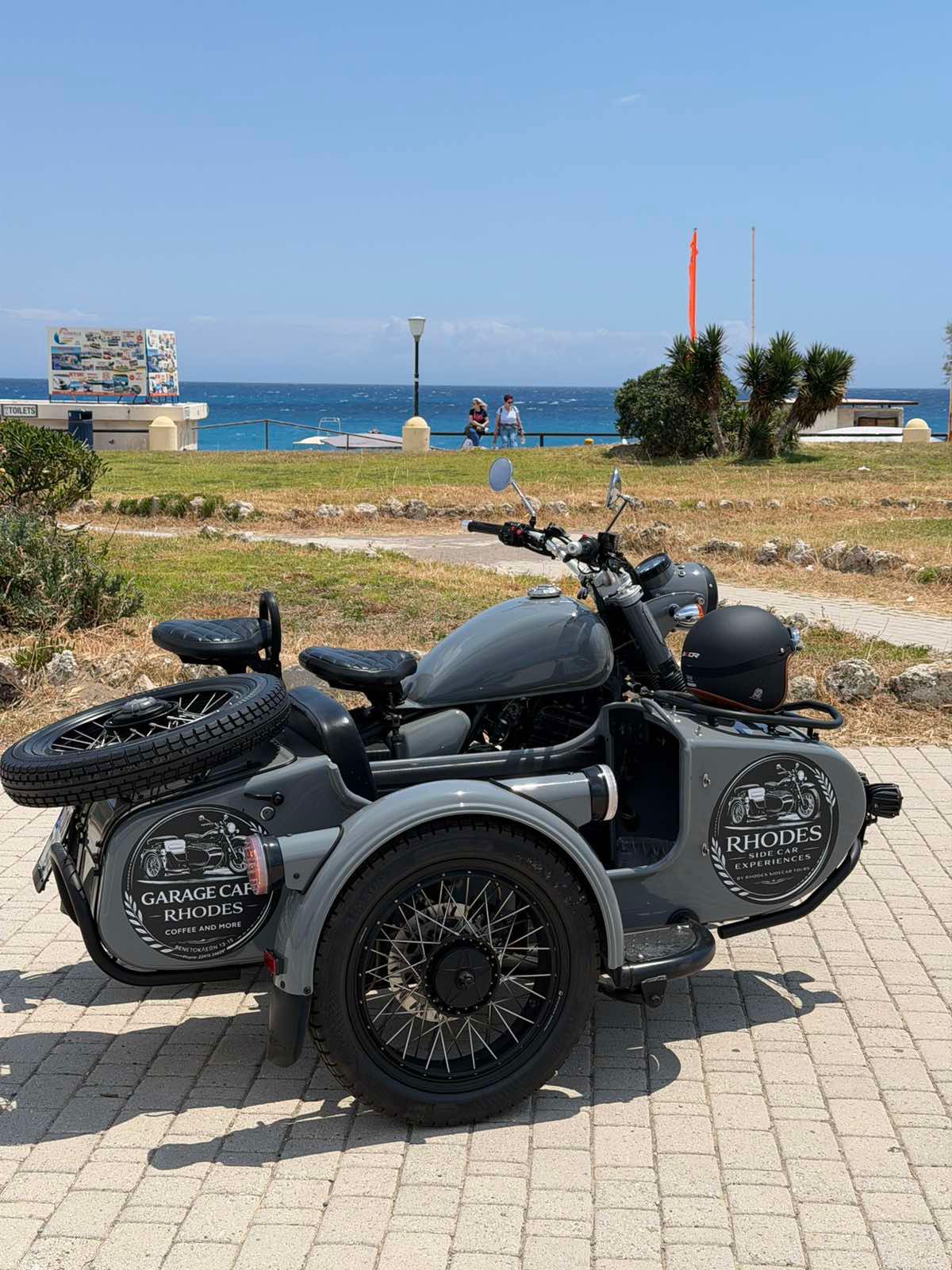 Vintage sidecar parked along the Rhodes coastline
