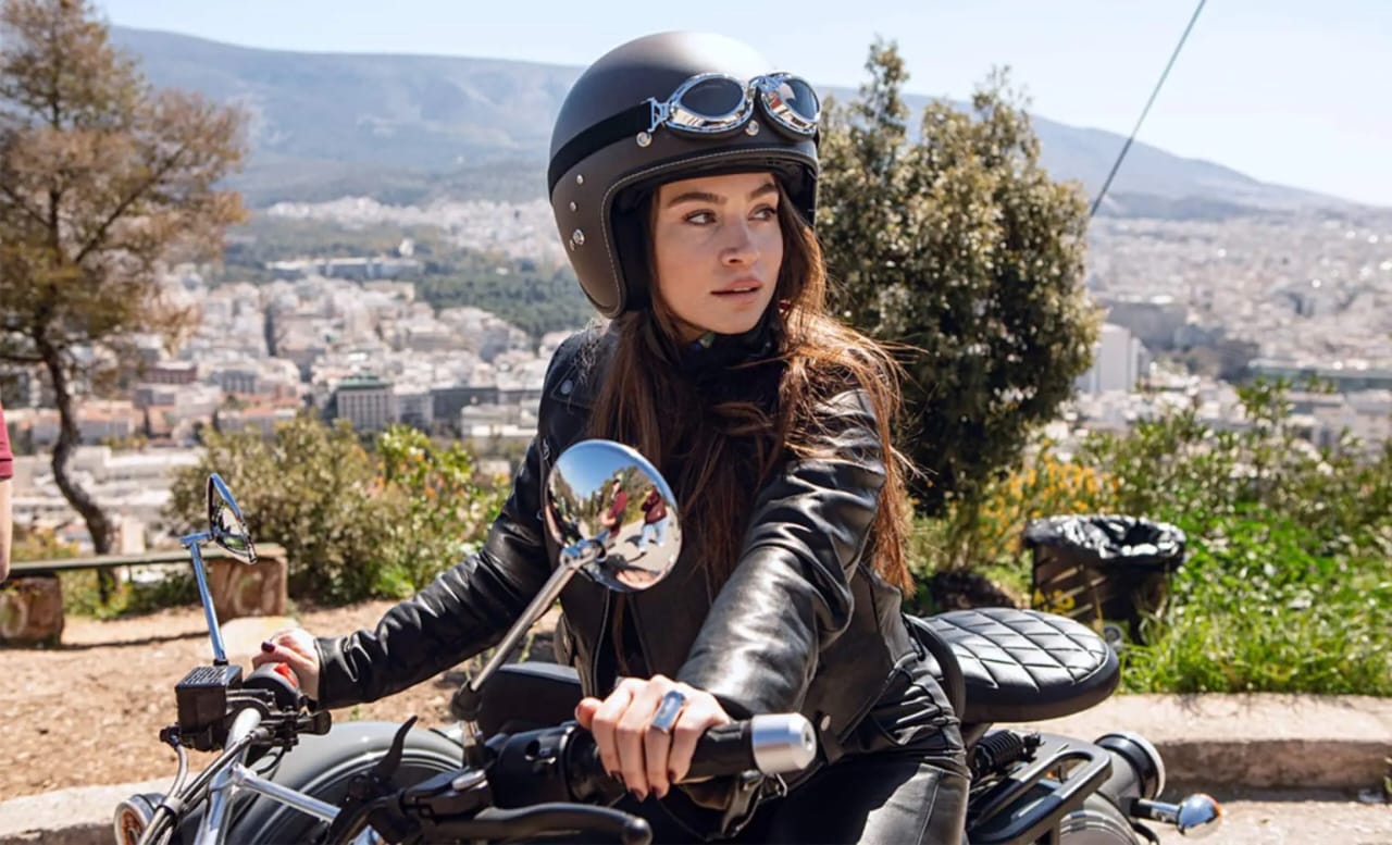Guests riding in a vintage sidecar through the streets of Rhodes